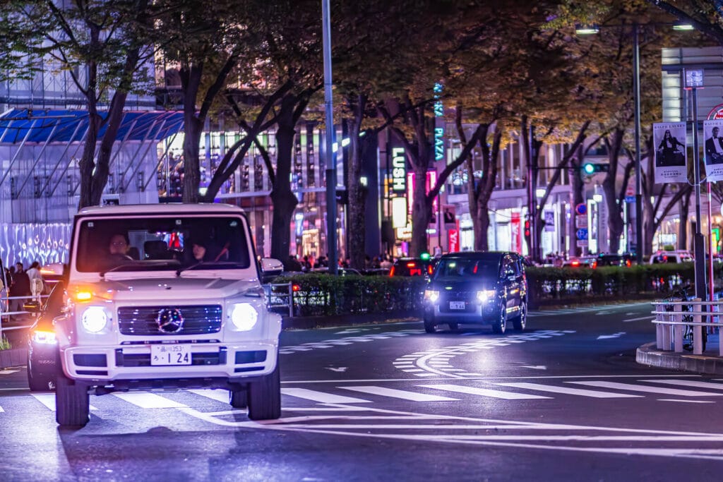 Four wheelers on Omotesando street in the night.